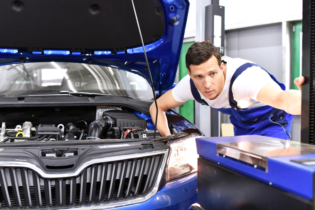 Adjusting,The,Headlights,On,The,Car,By,Mechanics,In,A